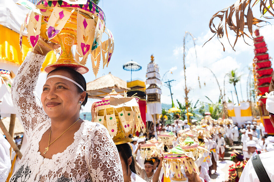 Women carrying offerings on their heads, Odalan temple festival, Sidemen, Karangasem, Bali, Indonesia