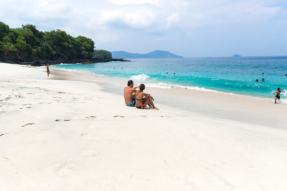 Vacationers at the white sand beach, Padangbai, Bali, Indonesia