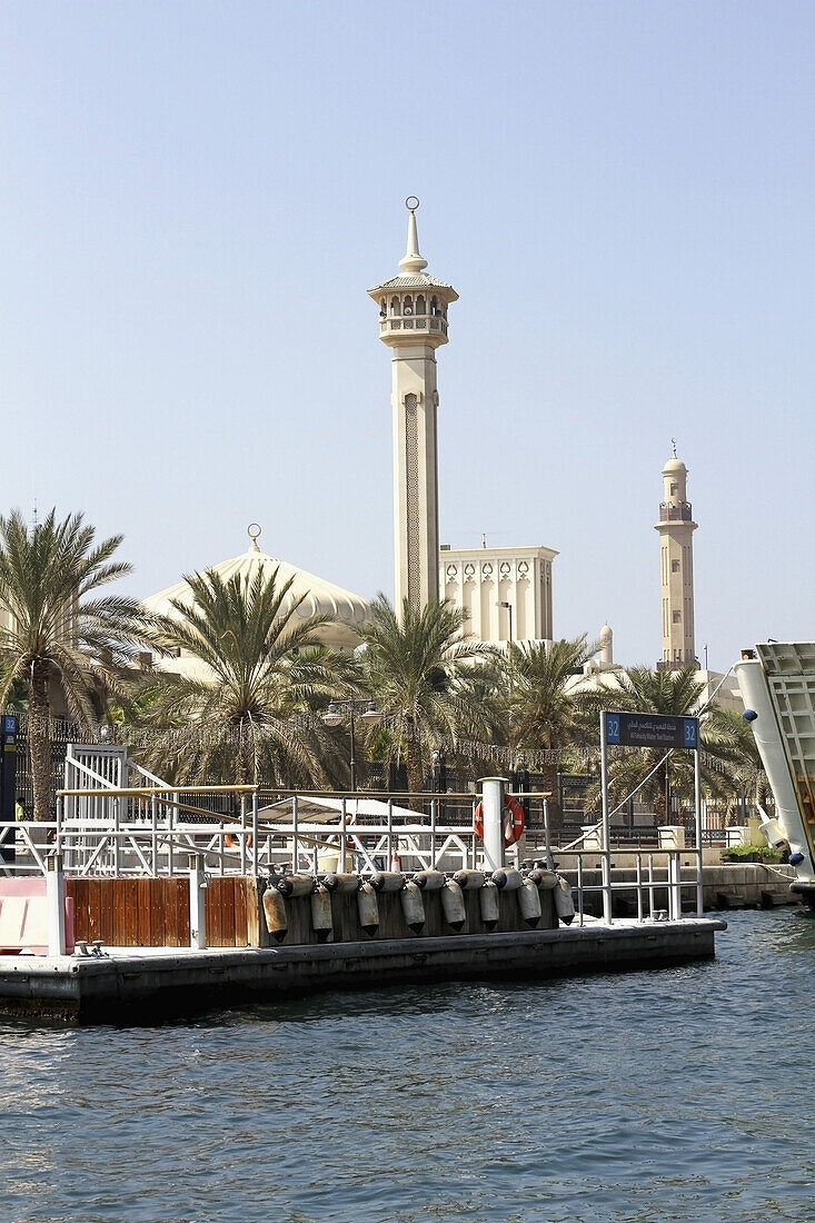 Water taxi dock and Grand Mosque in background in Bur Dubai, Dubai Creek, United Arab Emirates