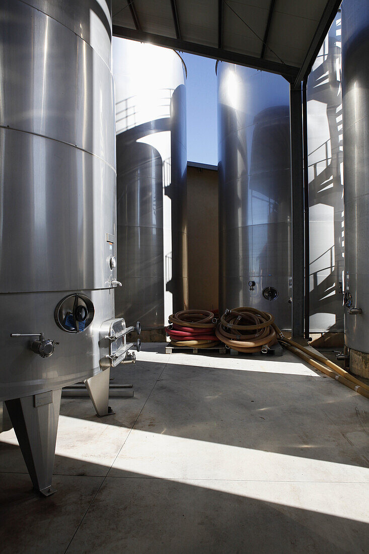 Modern stainless steel wine tanks at a winery