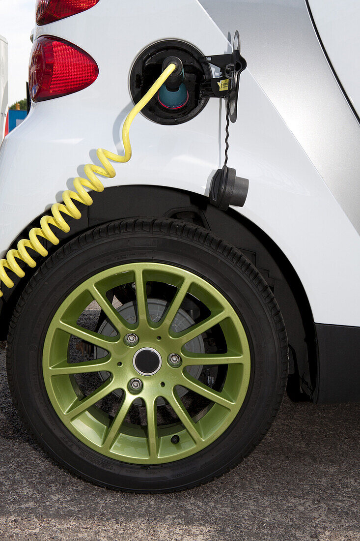 Detail of a charger connected to an electric car recharging