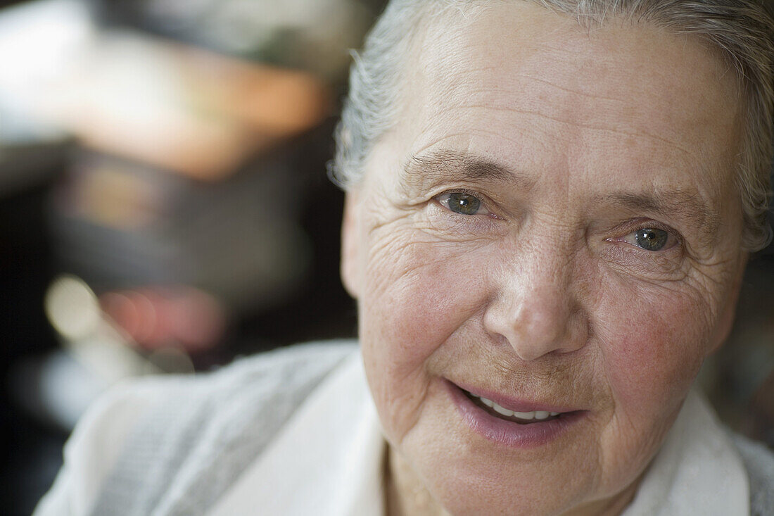 A cheerful senior woman, close-up