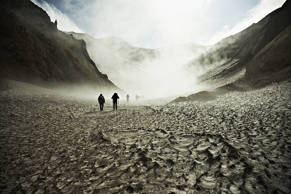 Hikers trekking through the Mutnovsky Volcano, Kamchatka, Russia