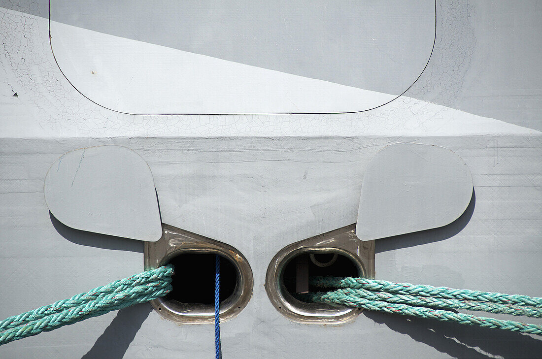 Outlets for ropes on a moored boat