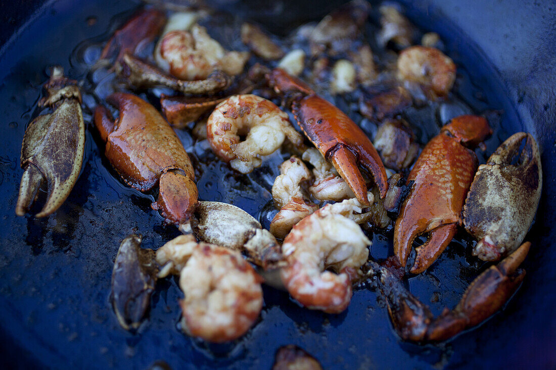 Freshwater Yabby claws and prawns in cooking oil in pan