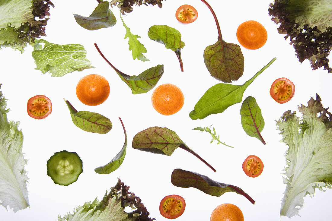 Various fruits and vegetables arranged on a lightbox