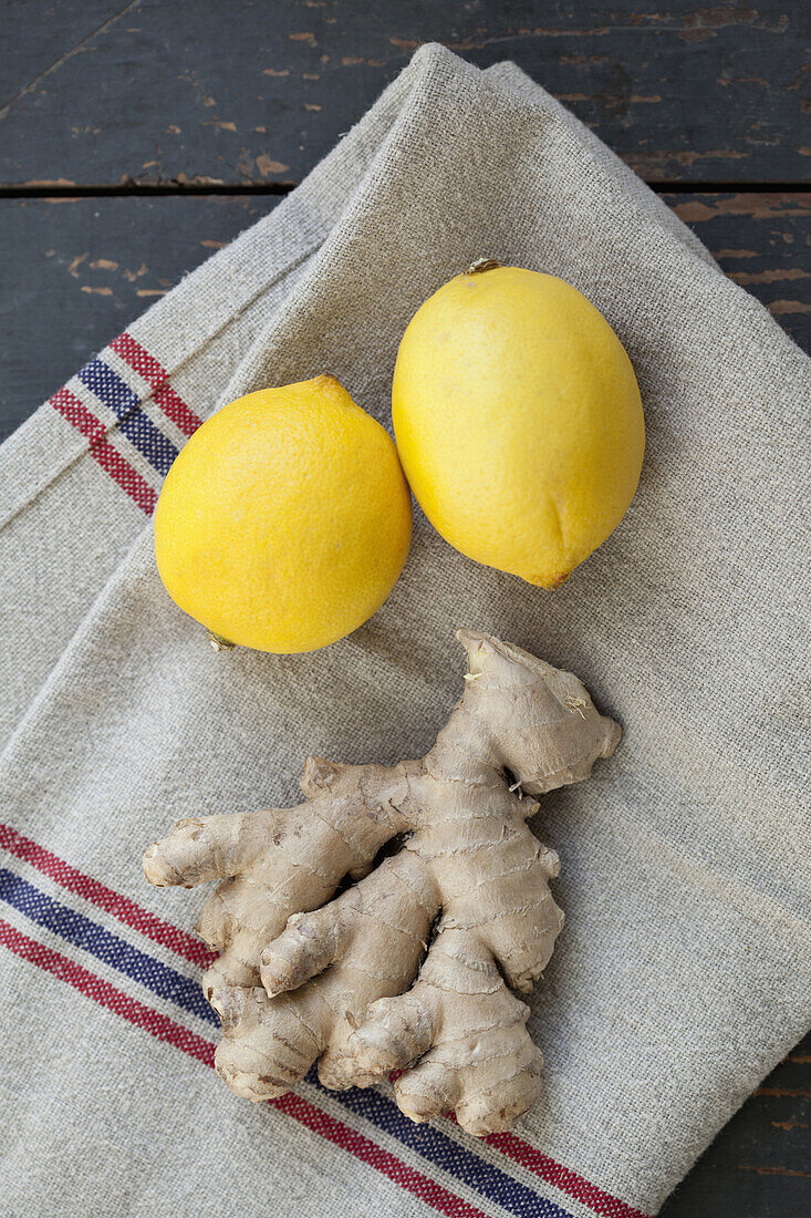 Close-up of lemon and ginger on napkin