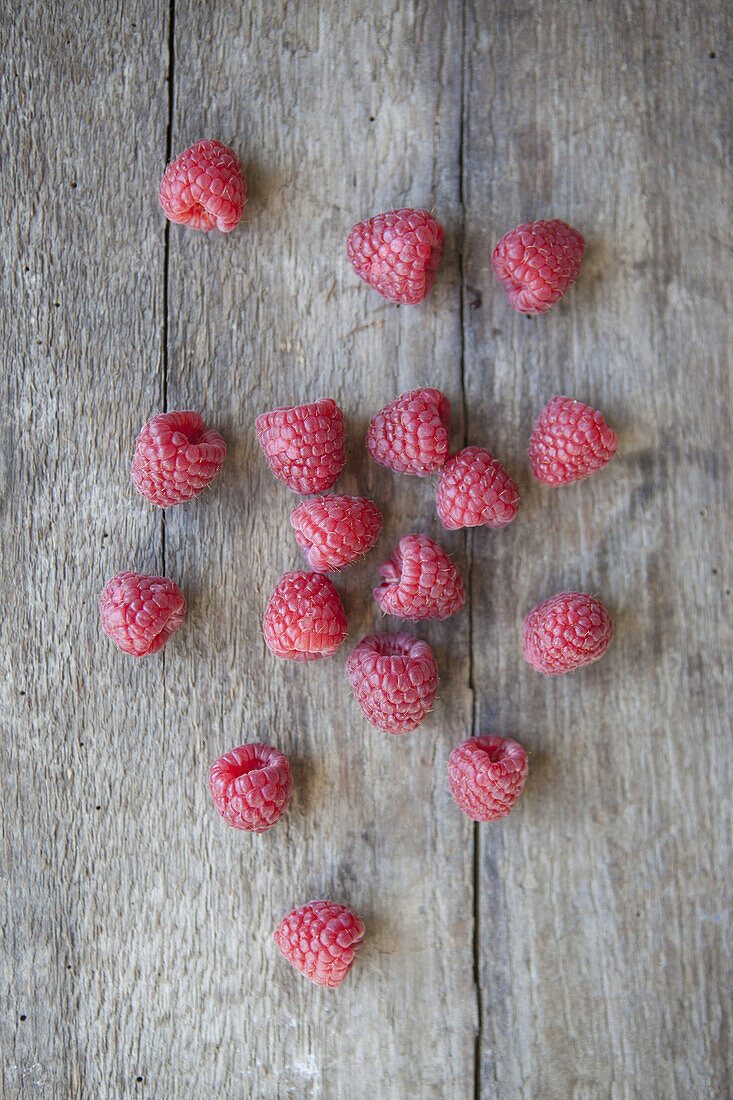 Close-up of raspberries on wooden table