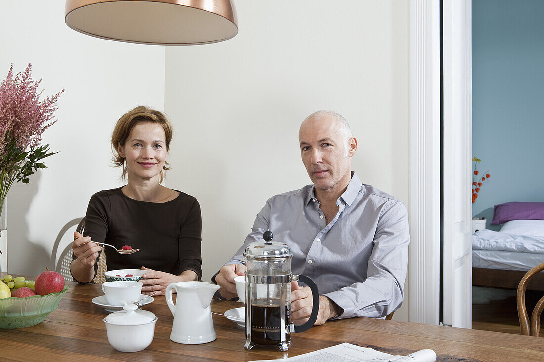 A mature couple having breakfast together