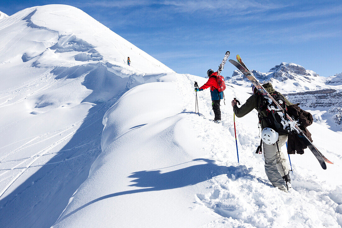 Two skiers ascending in deep snow, freeride skiing area Haldigrat, Niederrickenbach, Oberdorf, Canton of Nidwalden, Switzerland