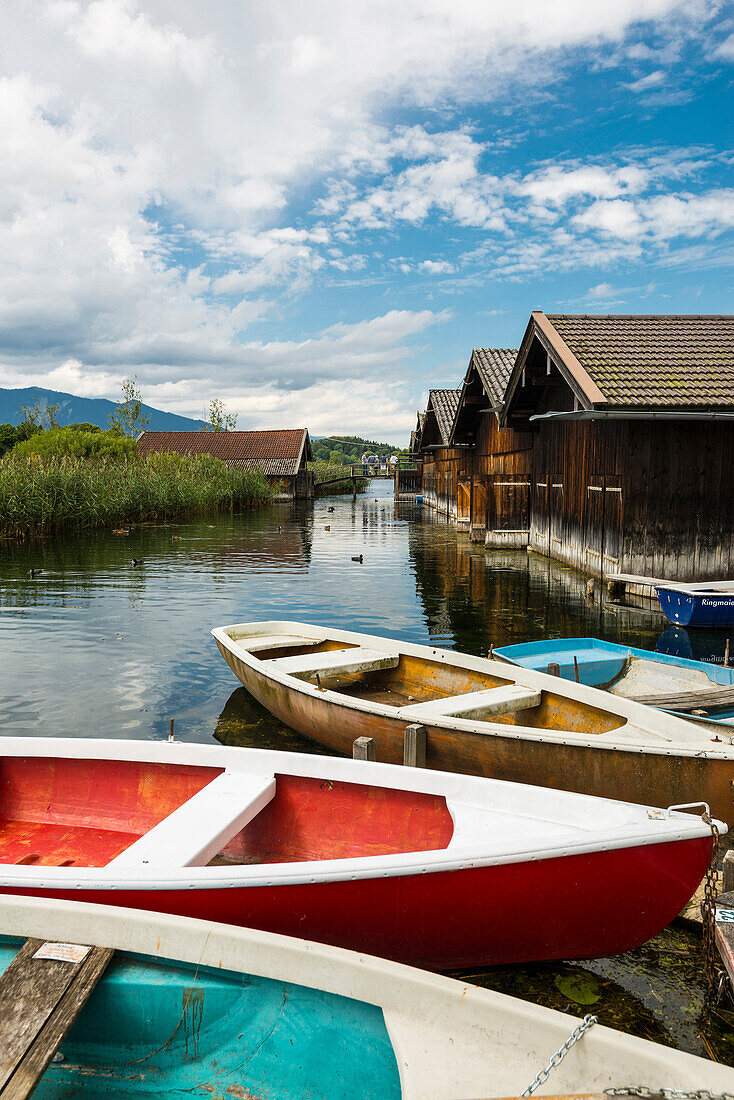 Boats and boat houses at lake Staffelsee, Seehausen, near Murnau, Bavaria, Germany