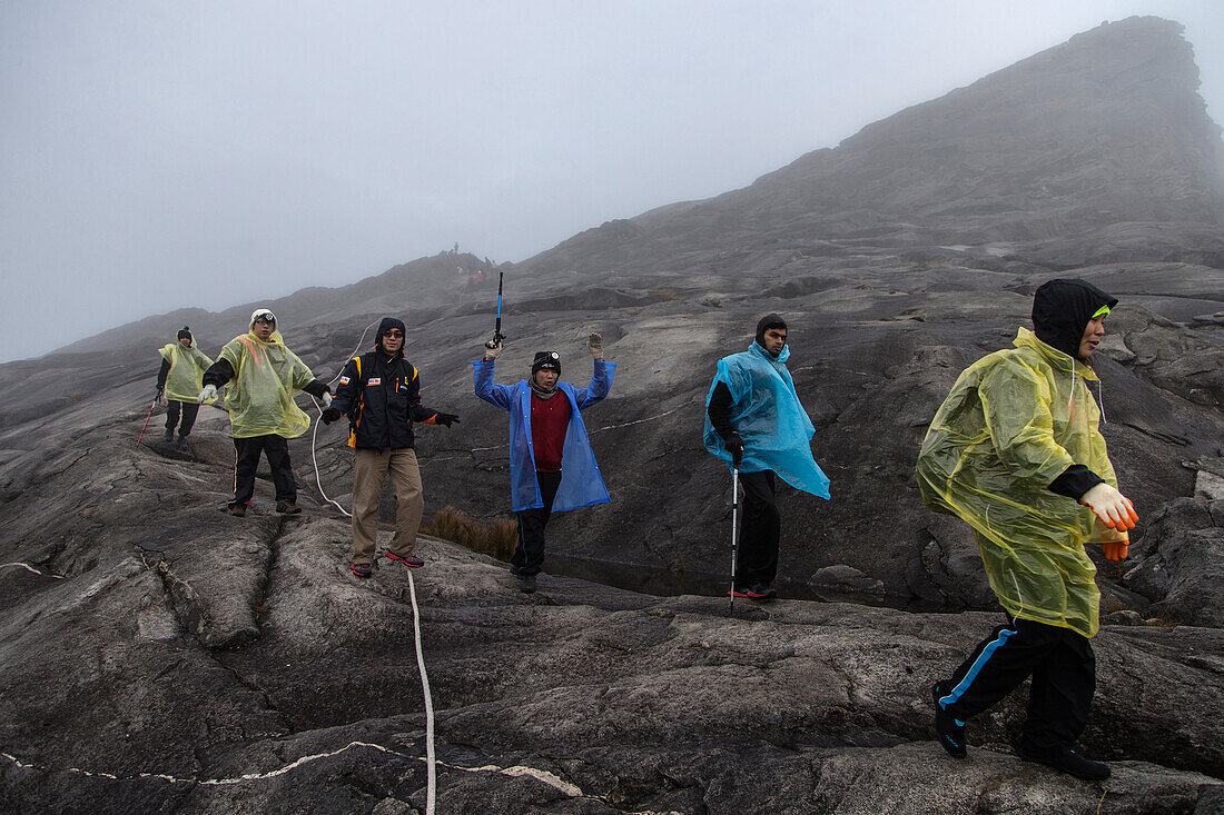 Mountain-Tourists climbing down from the Low's Peak 4091 m, Mount Kinabalu, Borneo, Malaysia