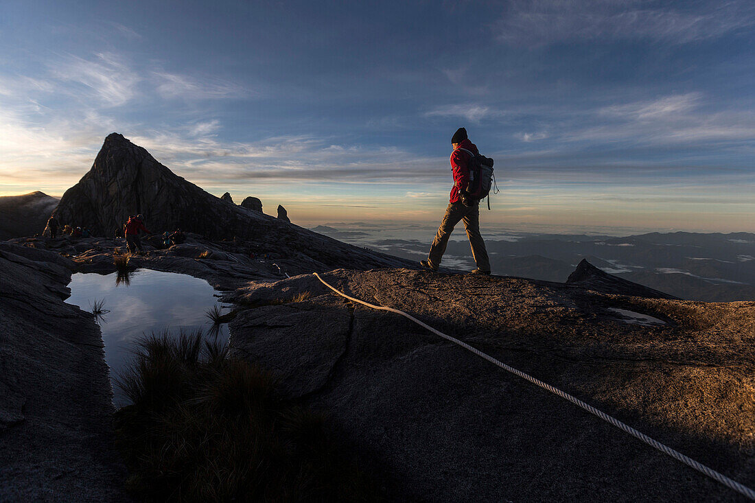 Mountain Tourists climbing up and down from the Low's Peak 4091 m, Mount Kinabalu, Borneo, Malaysia