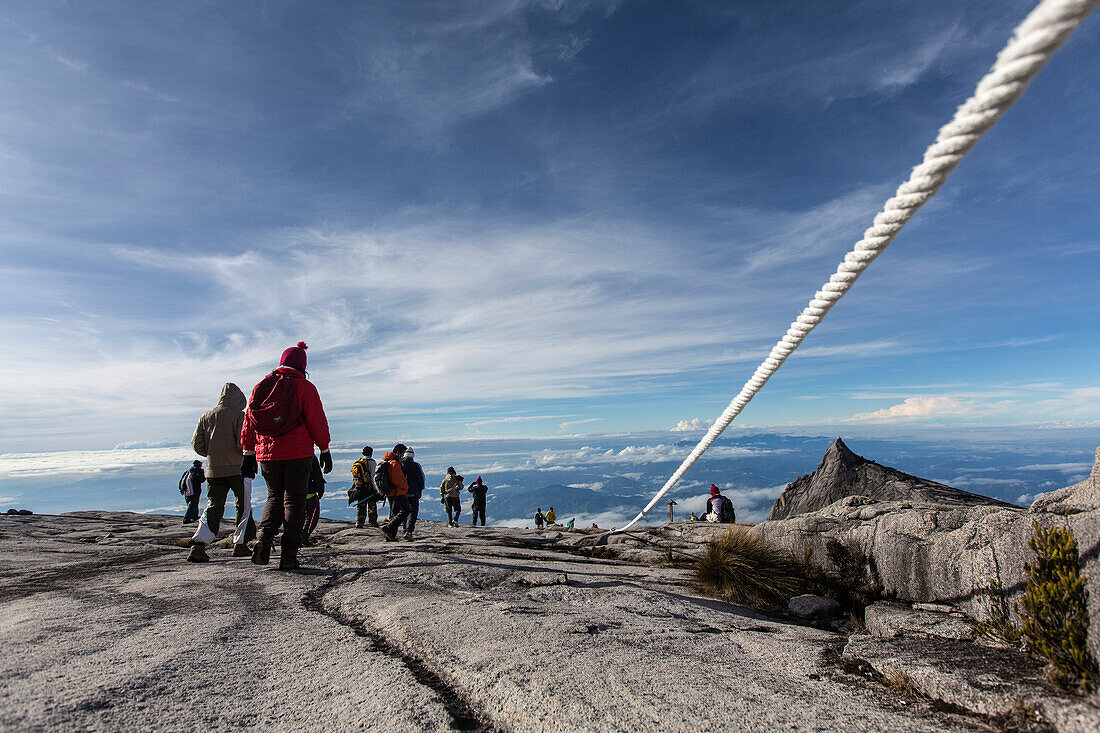 Mountain Tourists climbing down from the Low's Peak 4091 m, Mount Kinabalu, Borneo, Malaysia