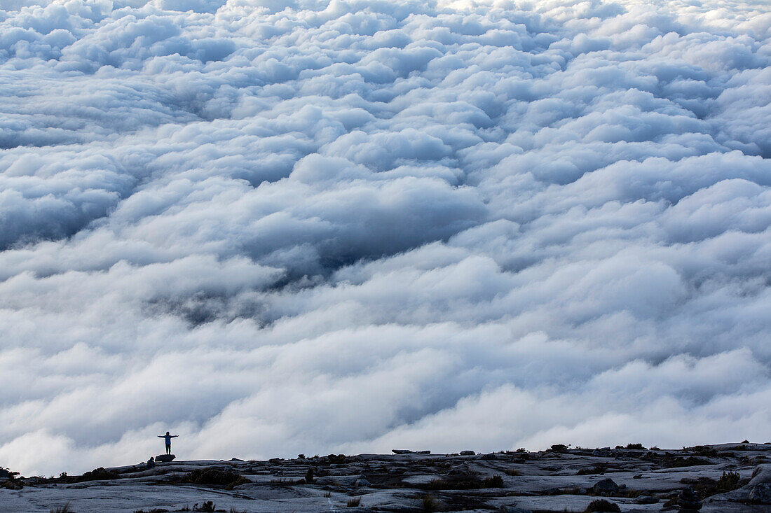 Mountain Tourists climbing down from the Low's Peak 4091 m, Mount Kinabalu, Borneo, Malaysia