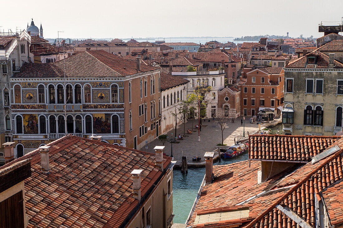 view from Music Conservatory, across tiled roofs, Canal Grande and Rio de San Vio and Palazzo da Mulo Morosini, Venice, Italy