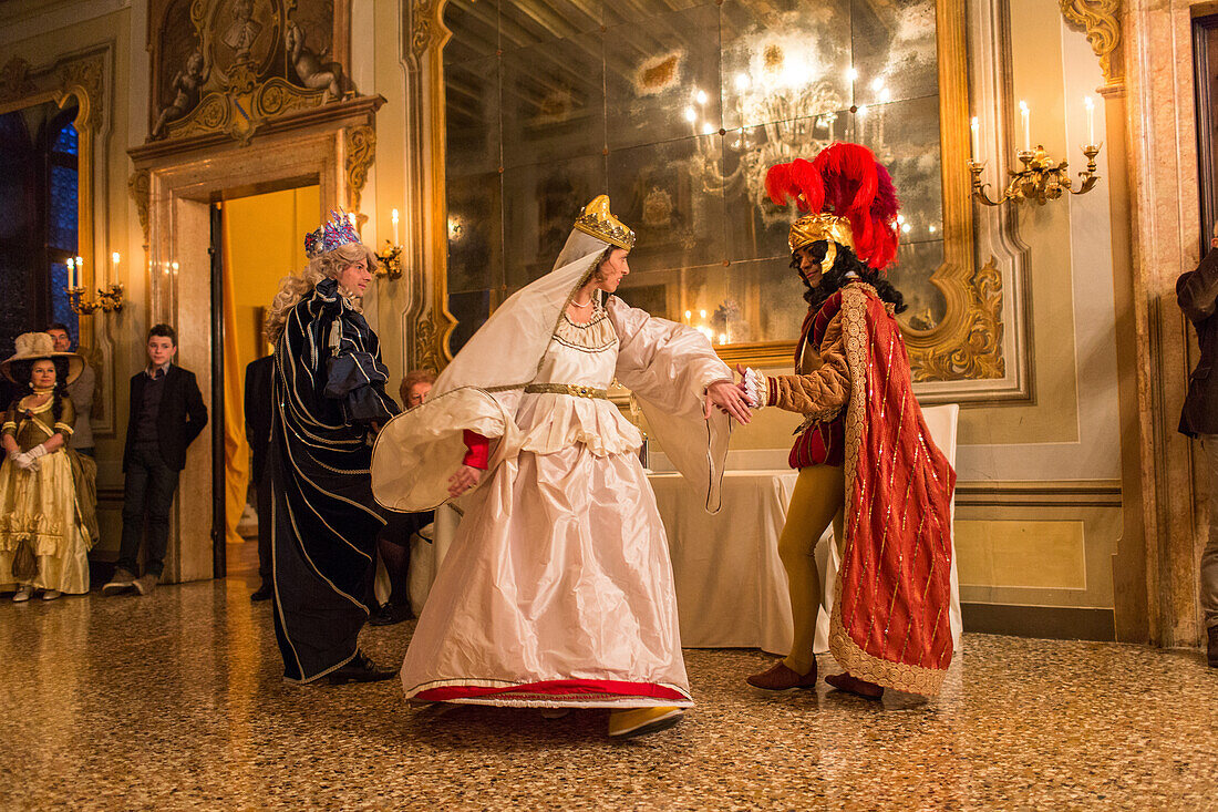 Carnival, guests dance in costumes, Palazzo Zeno ai Frari, piano nobile, noble floor, private masked ball, Venice, Italy