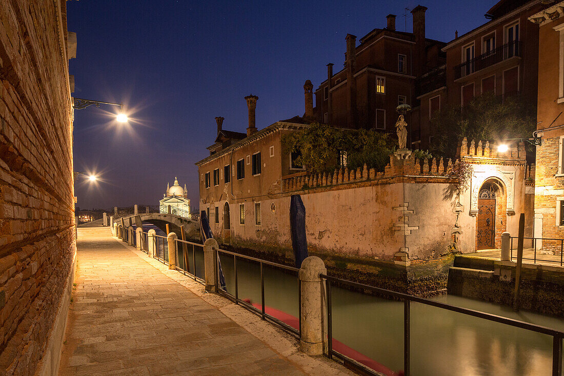 Rio dela Fornace, Zattere, high walls, gardens, fondamenta, pavement along canal, night time, lights, railing, canal, empty, still, Venice, Italy