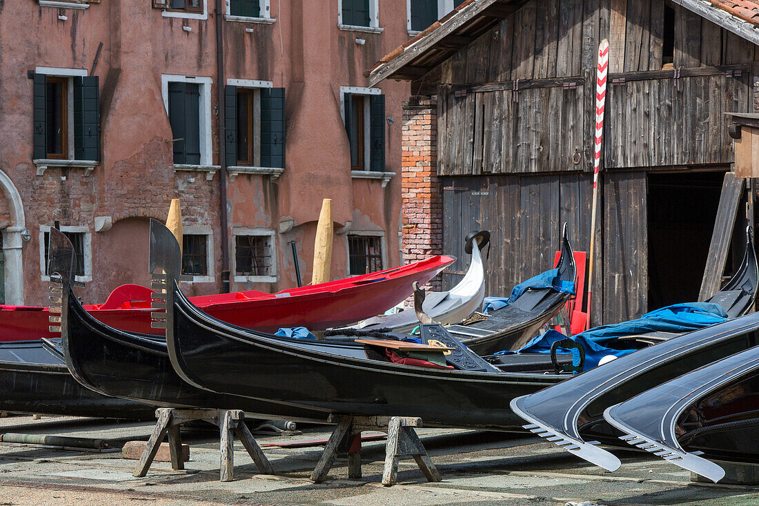 squero, Lorenzo della Toffola, traditional gondola boat builder, dry dock, maintenance, black lacquer, decoration, Venice, Veneto, Italy