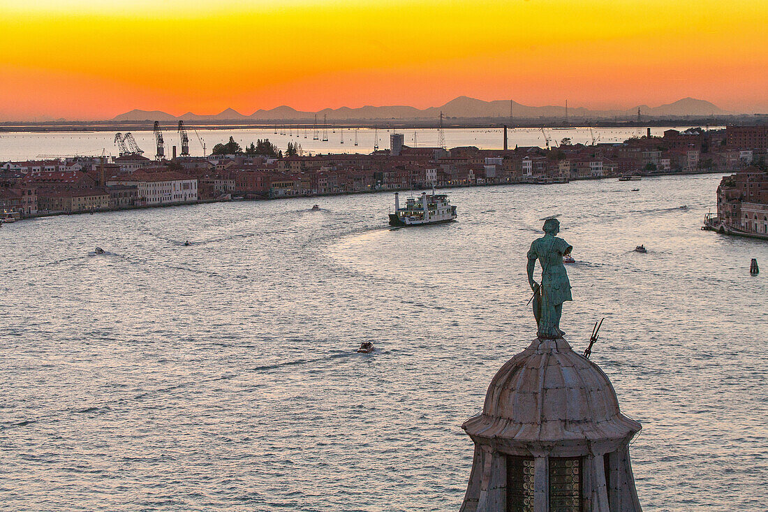 view from campanile above the dome of San Giorgio Maggiore, Giudecca Canal, red sunset, horizon, Euganean Hills, lagoon, Venice, Italy
