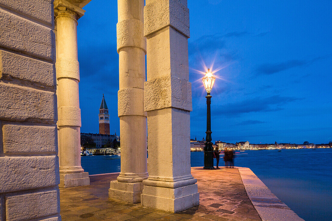 Night shot, Punta della Dogana, street light, lamp on the point, former customs house, columns of art museum, Giudecca Canal and the Grand Canal, Dorsoduro, Venice Italy