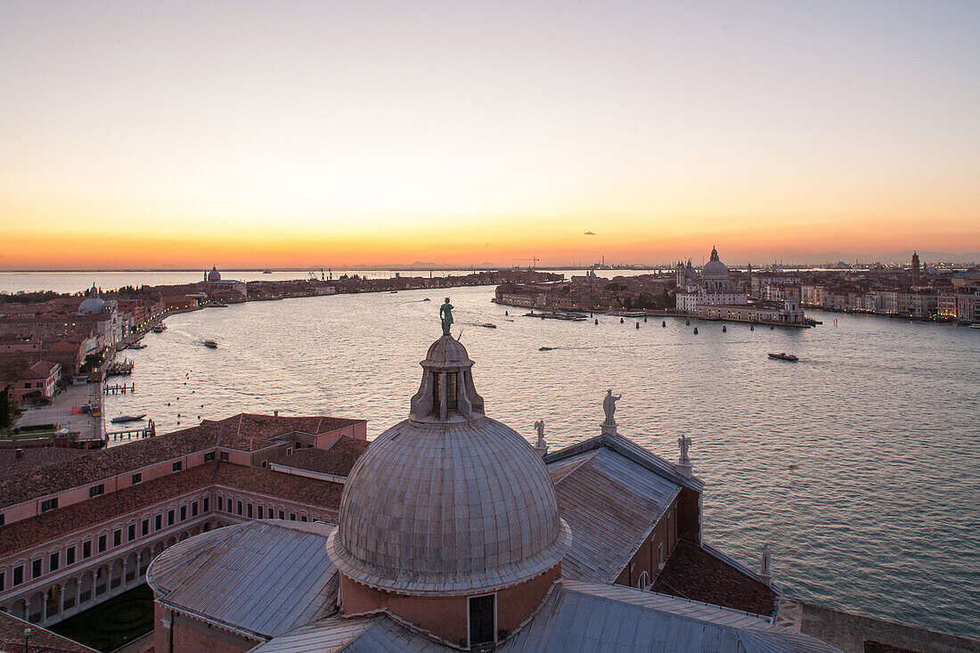 sunset, horizon, evening view above dome of San Giorgio Maggiore, Giudecca Canal, St Mark's Square, lagoon, Venice, Italy
