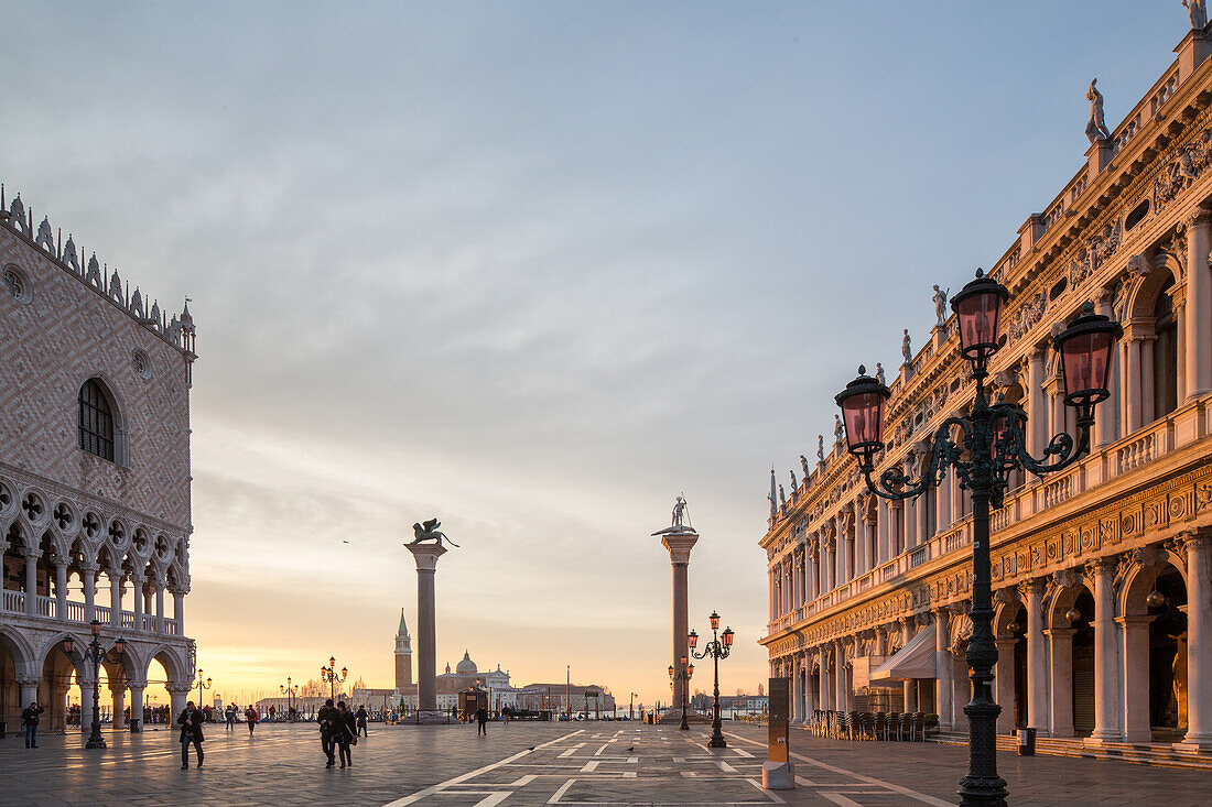 sunrise Piazzetta, facades of St Mark's Square, Biblioteca, columns, Saint Theodore, Lion of Venice, Italy