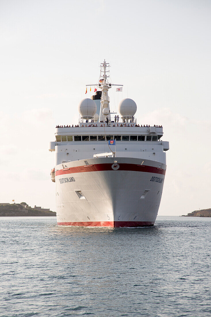 Cruise ship MS Deutschland (Reederei Peter Deilmann) sailing into Mahon harbour, Mahon, Menorca, Balearic Islands, Spain