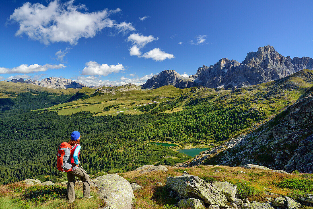 Woman looking towards lake Colbricon with Pala range in background, Trans-Lagorai, Lagorai range, Dolomites, UNESCO World Heritage Site Dolomites, Trentino, Italy