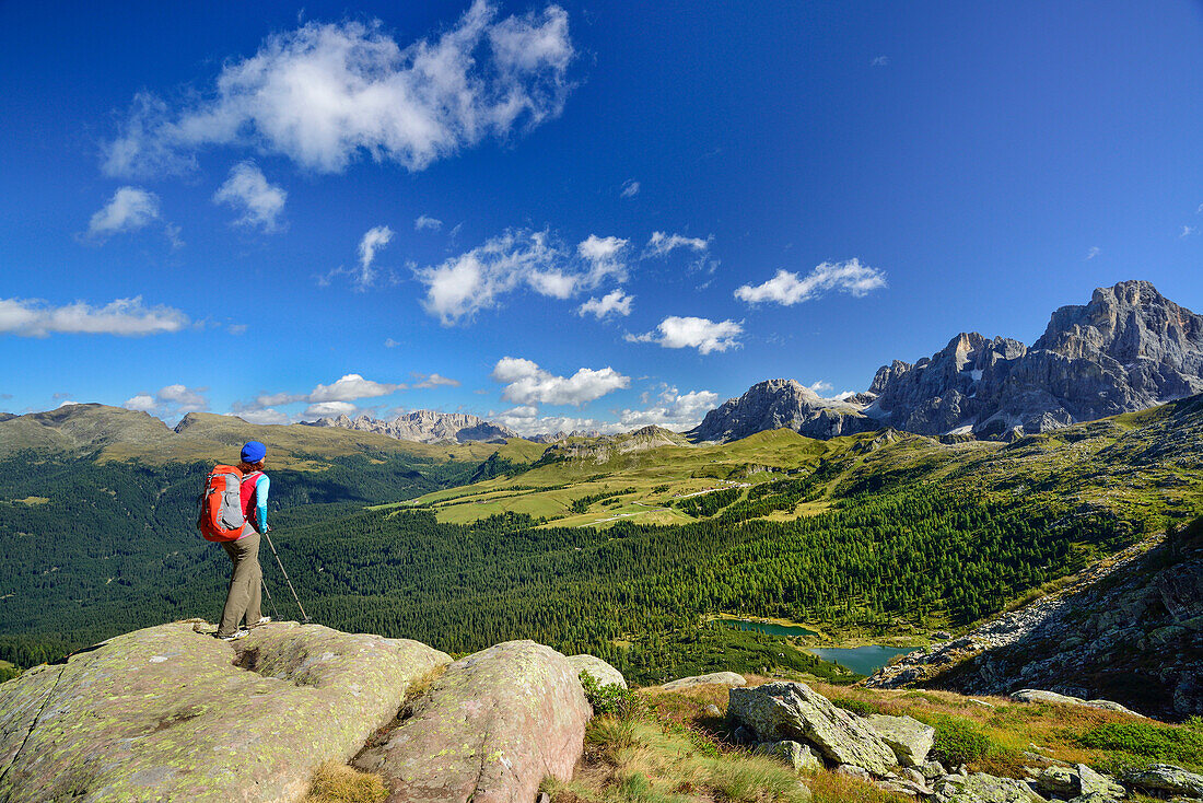 Woman looking towards lake Colbricon with Pala range in background, Trans-Lagorai, Lagorai range, Dolomites, UNESCO World Heritage Site Dolomites, Trentino, Italy