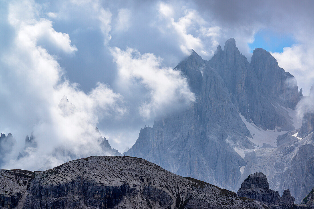 Cadini range with clouds, Alpine hut, Auronzo-Huette, Drei Zinnen, Tre Cime di Lavaredo, UNESCO World Heritage Site Dolomites, Dolomites, Veneto, Italy