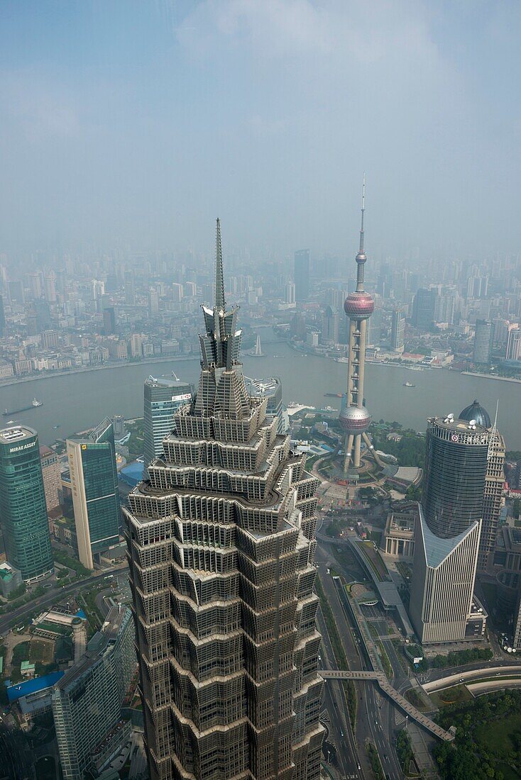 The Lujiazui financial district in Pudong and the skyline of the city of Shanghai China as seen from the World Financial Centre.