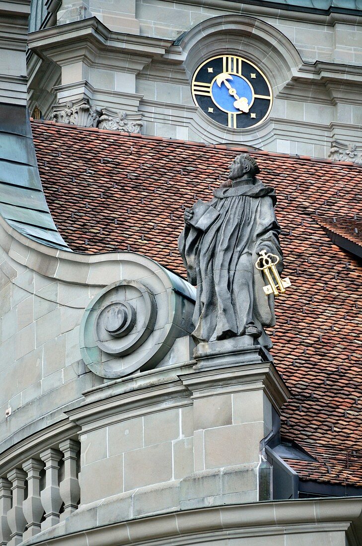 Statue of a Benedictine monk on the roof of Einsiedeln Monastery, Switzerland.