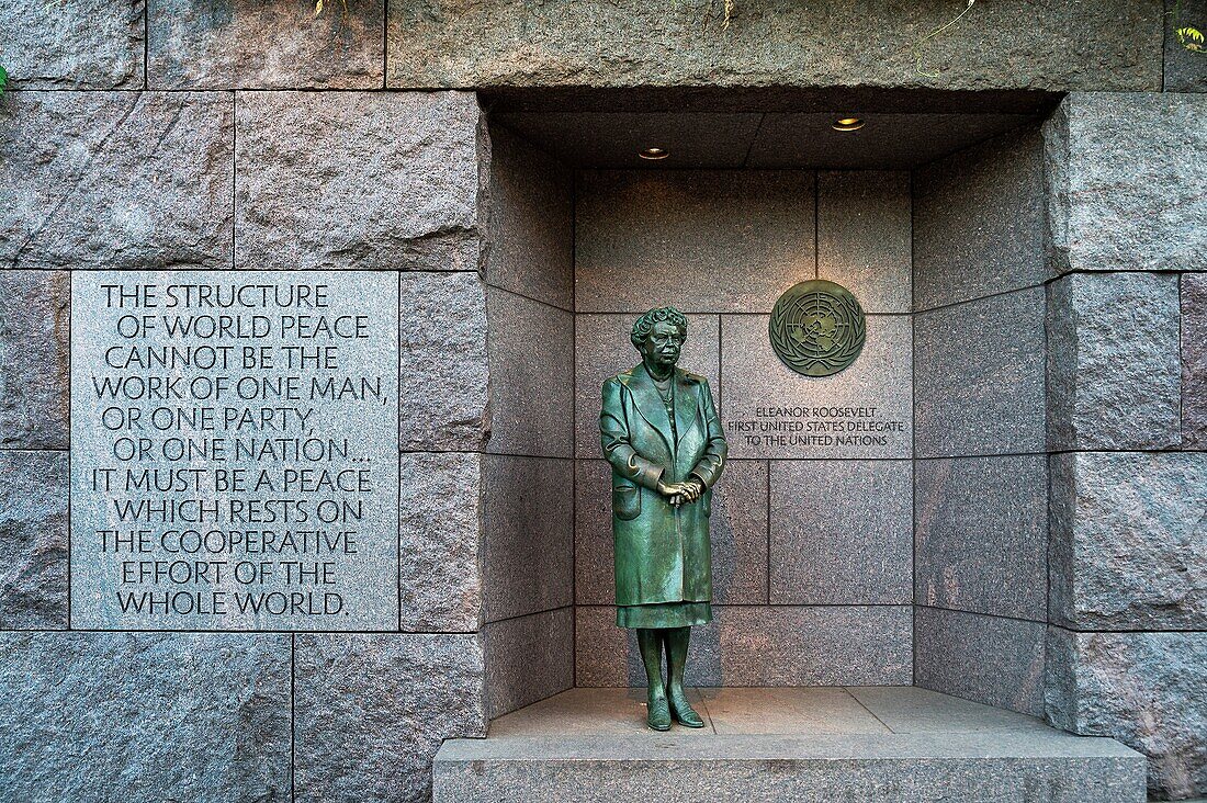 Bronze statue of First Lady Eleanor Roosevelt standing before the United Nations emblem honors her dedication to the UN, Franklin Delano Roosevelt memorial, Washington DC, USA.