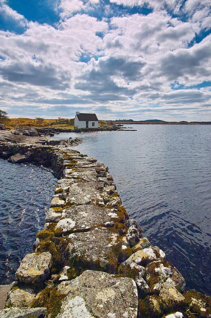 Boatkeepers office at the shore of a small lake in Connemara, near Maams Cross, County Galway, Ireland.