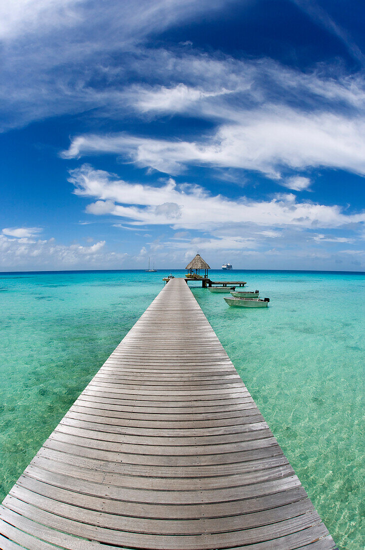 French Polynesia, Tuamotu Islands, Rangiroa Atoll, Resort Pier And Boats.