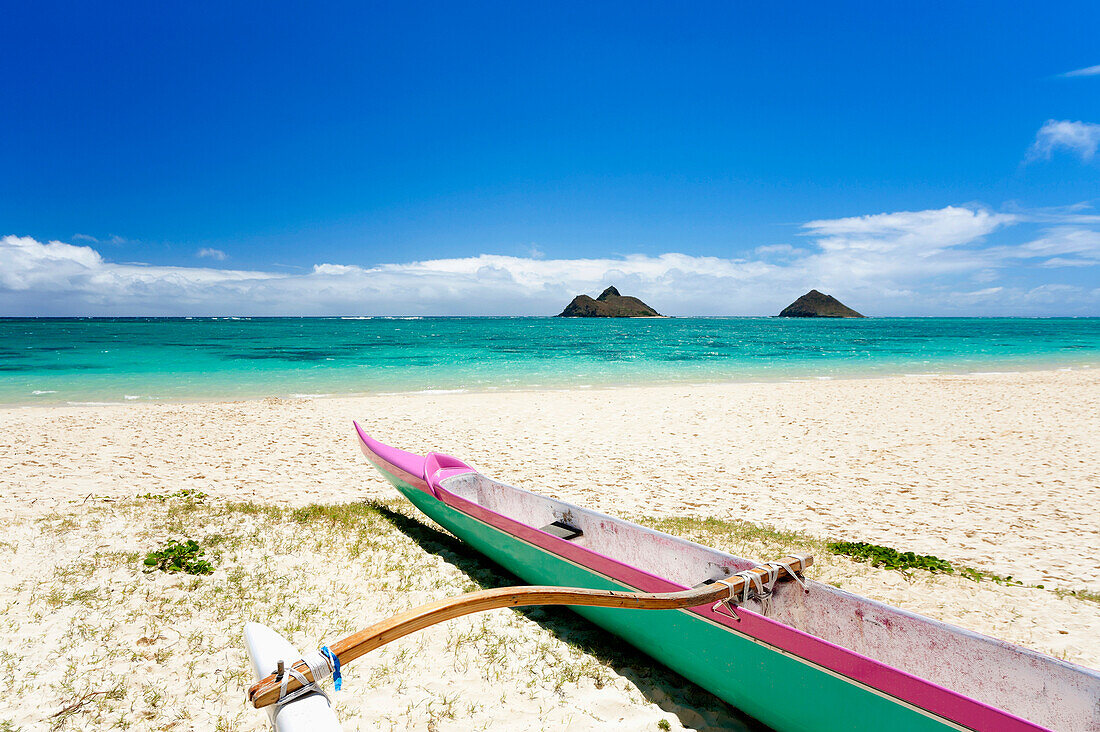 Hawaii, Oahu, Lanikai Beach, Colorful Outrigger Canoe On Sandy Shore, Mokulua Islands In Distance.