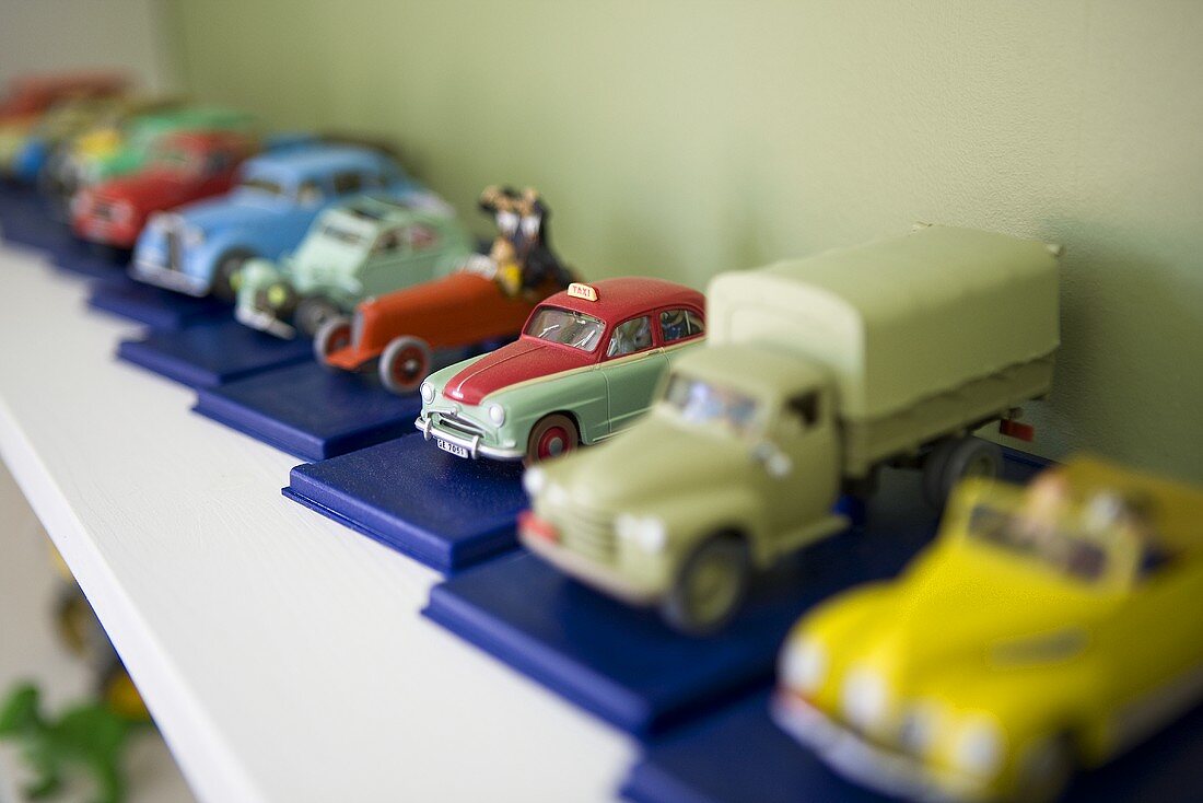 Tin cars on a shelf