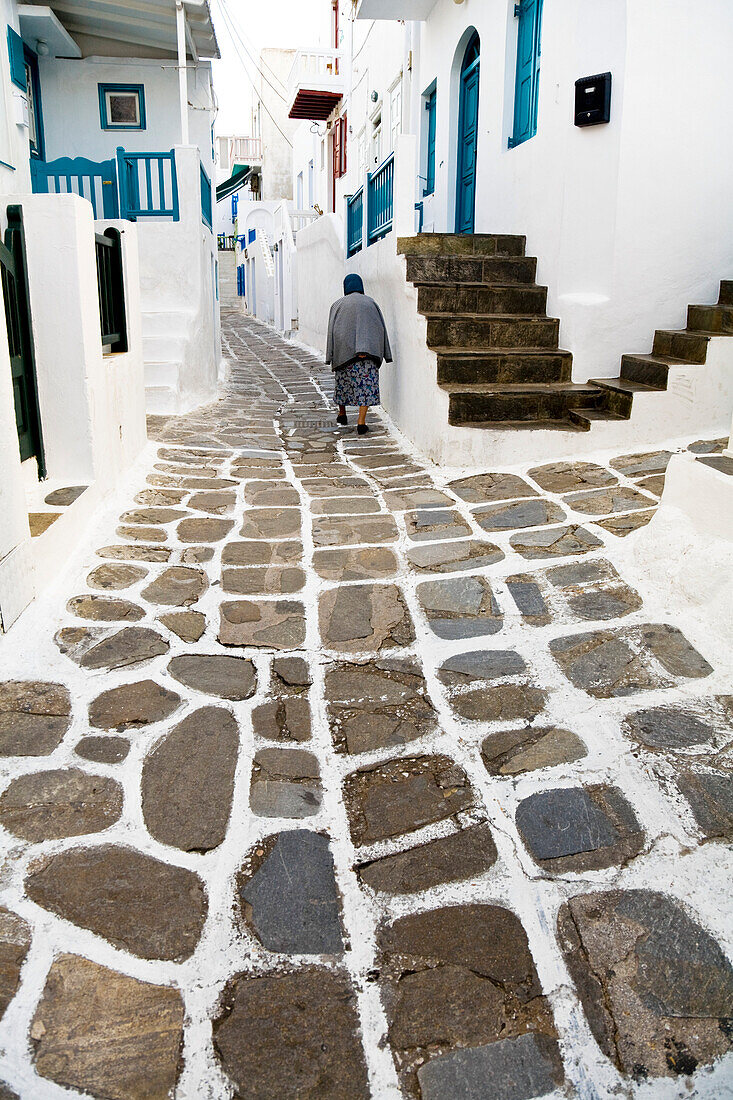 Woman Walking Down Street, And Houses With Typical Colour Scheme, Hora, Mykonos Island, Cyclades, Greece