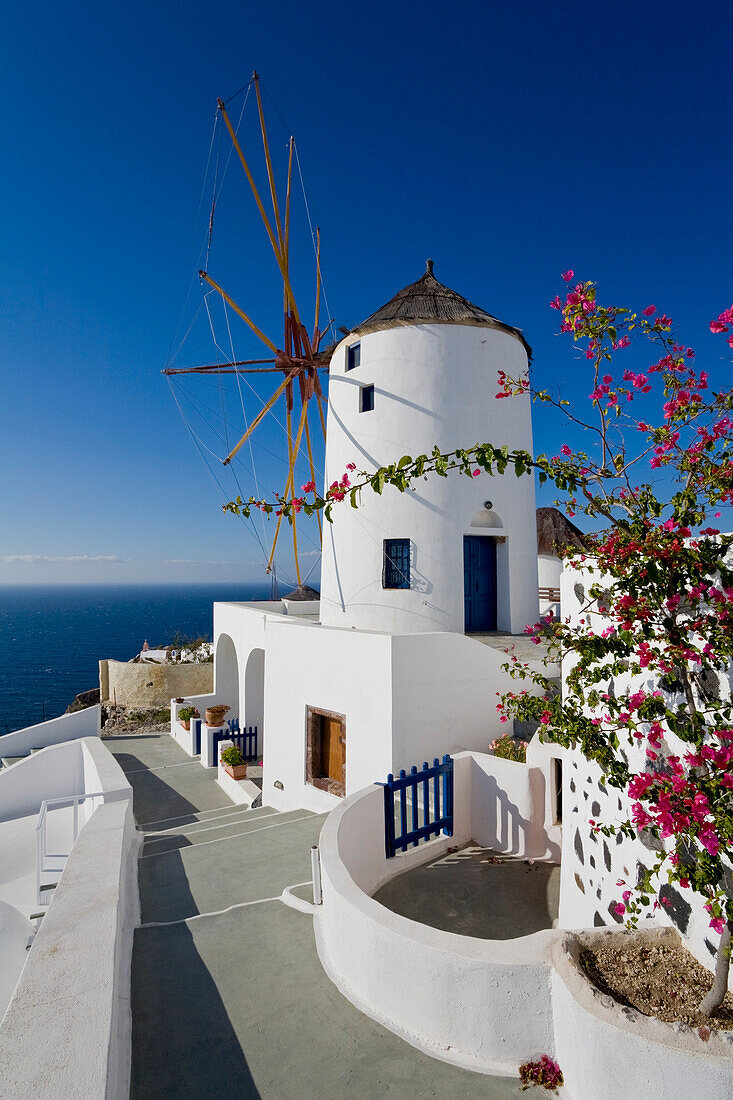 View Of A Building In The Village Of Oia Perched On Steep Cliffs Overlooking The Submerged Caldera, Santorini, Greece