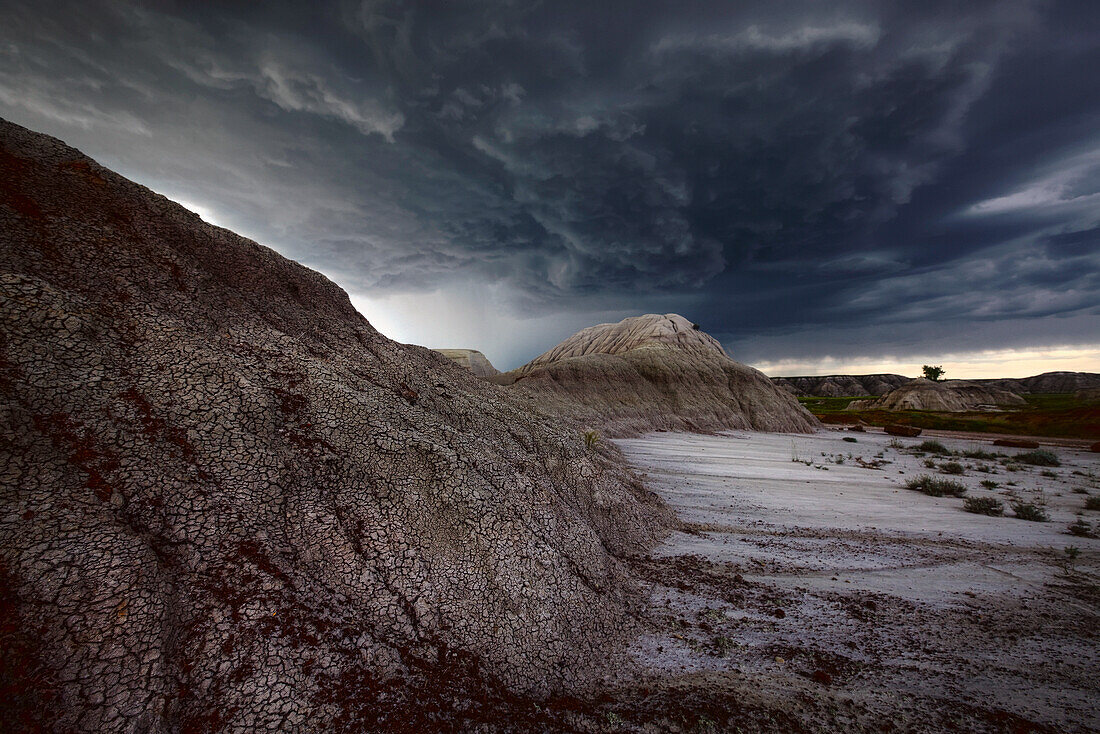 Storm Clouds Over The Badlands Of Dinosaur Provincial Park In Alberta