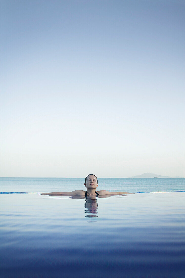 Woman Relaxing In Infinity Pool, Panama City, Panama