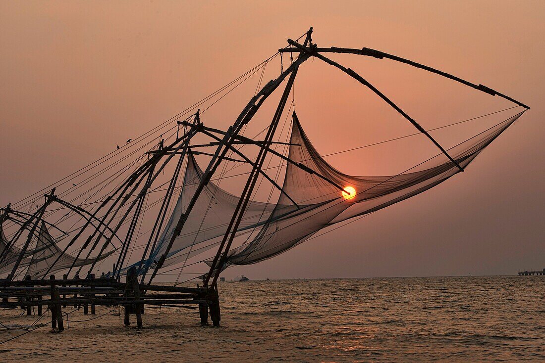 Chinese fish nets at sunset in Fort Cochin (Kochi) in Kerala, India.