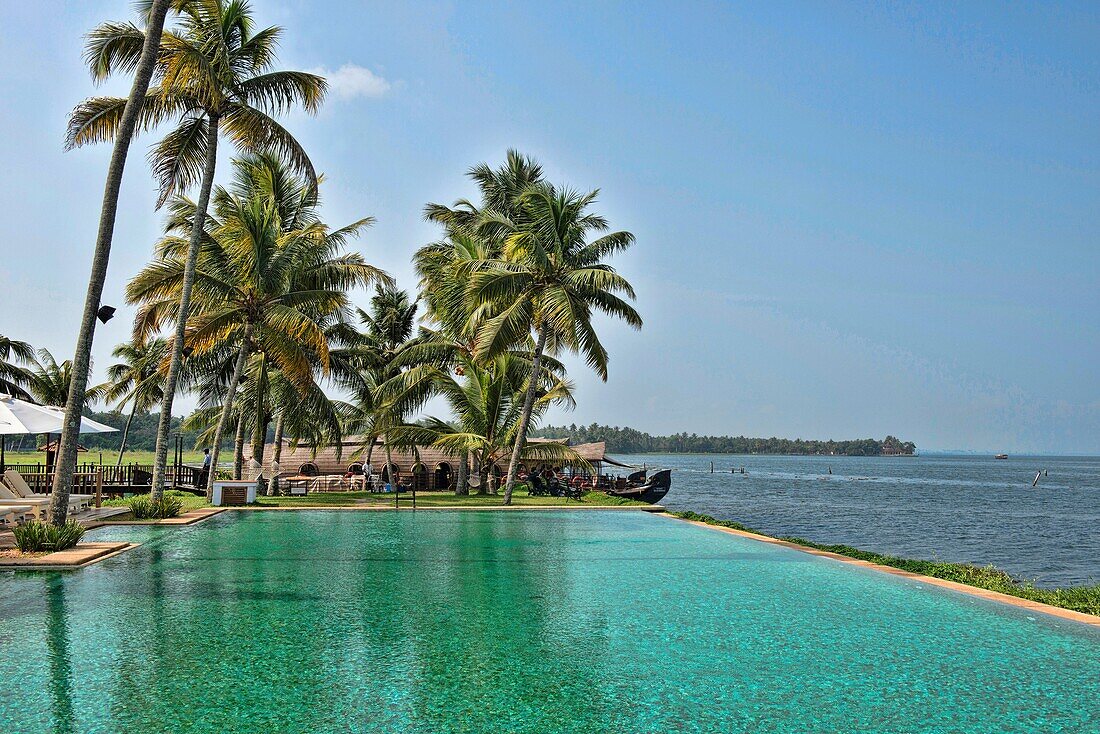 luxury resort swimming pool in the backwaters of Kerala, India.