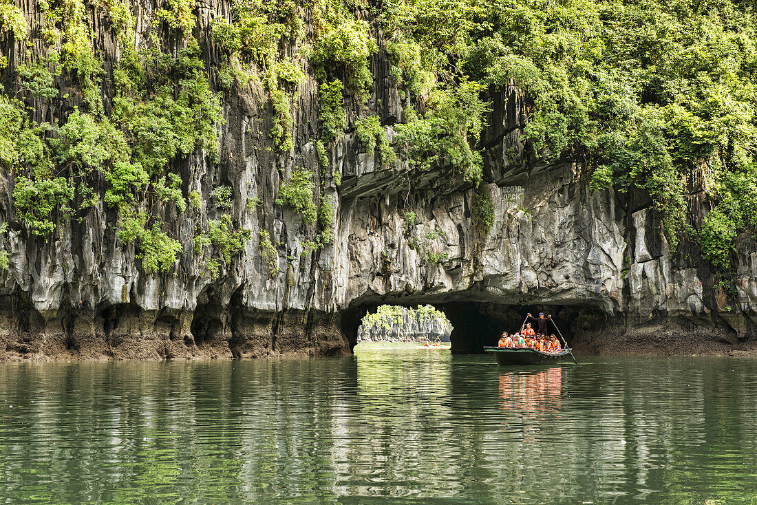 exploring a hidden lagoon by raft in Halong Bay, Vietnam.