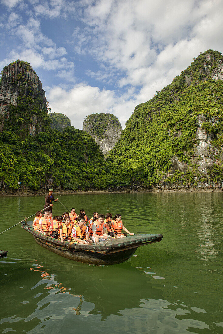 exploring a hidden lagoon by raft in Halong Bay, Vietnam.