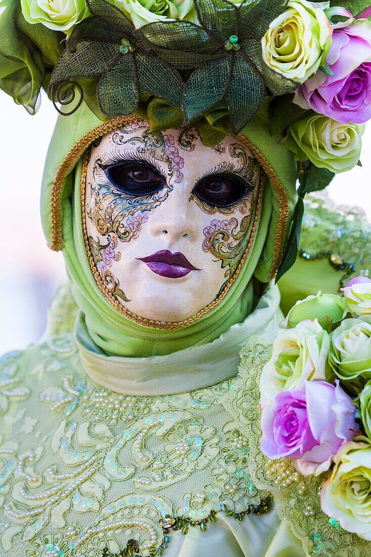 A masked woman at the carnival in Venice, Italy, Europe