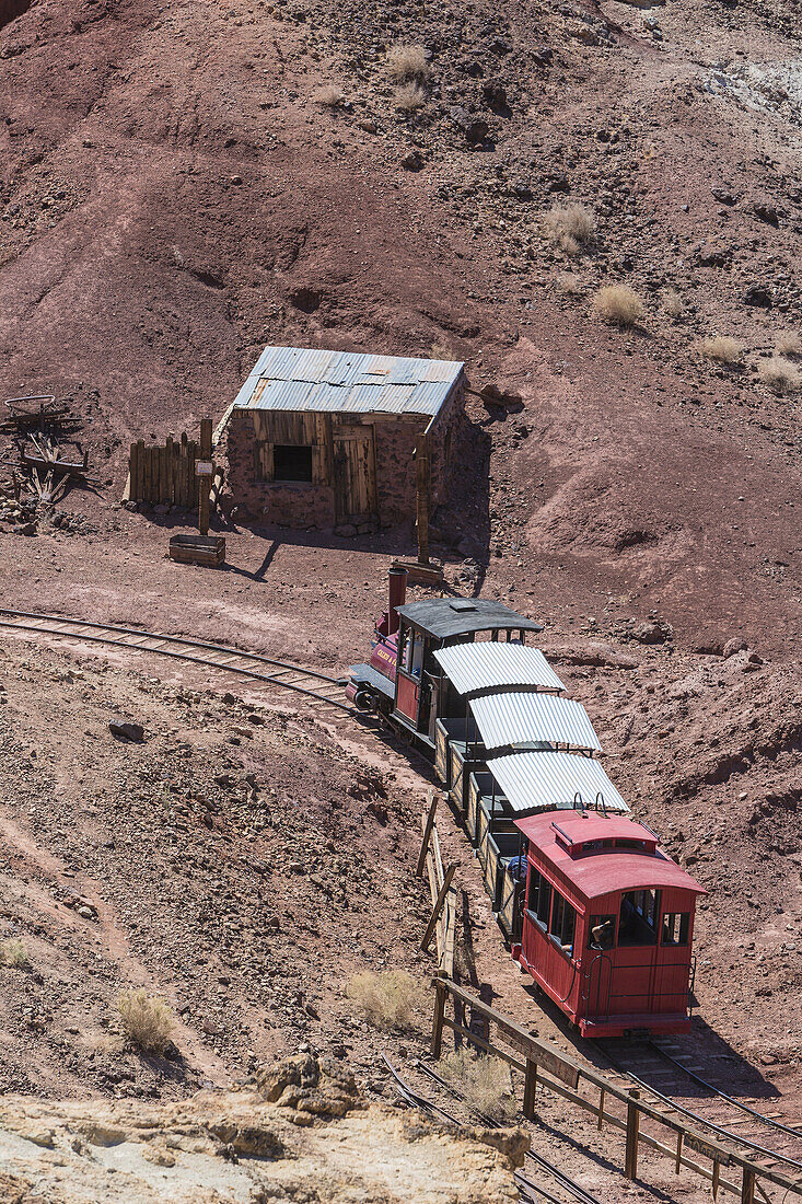 Historic train driving through the valley in Calico Ghost Town, California, USA