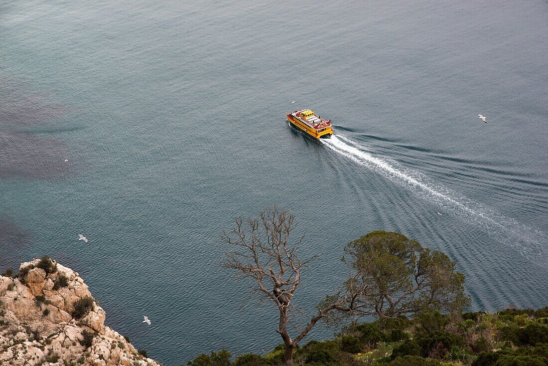 sightseeing boat surrounding the Rock of Ifach, Calpe, Alicante, Spain.