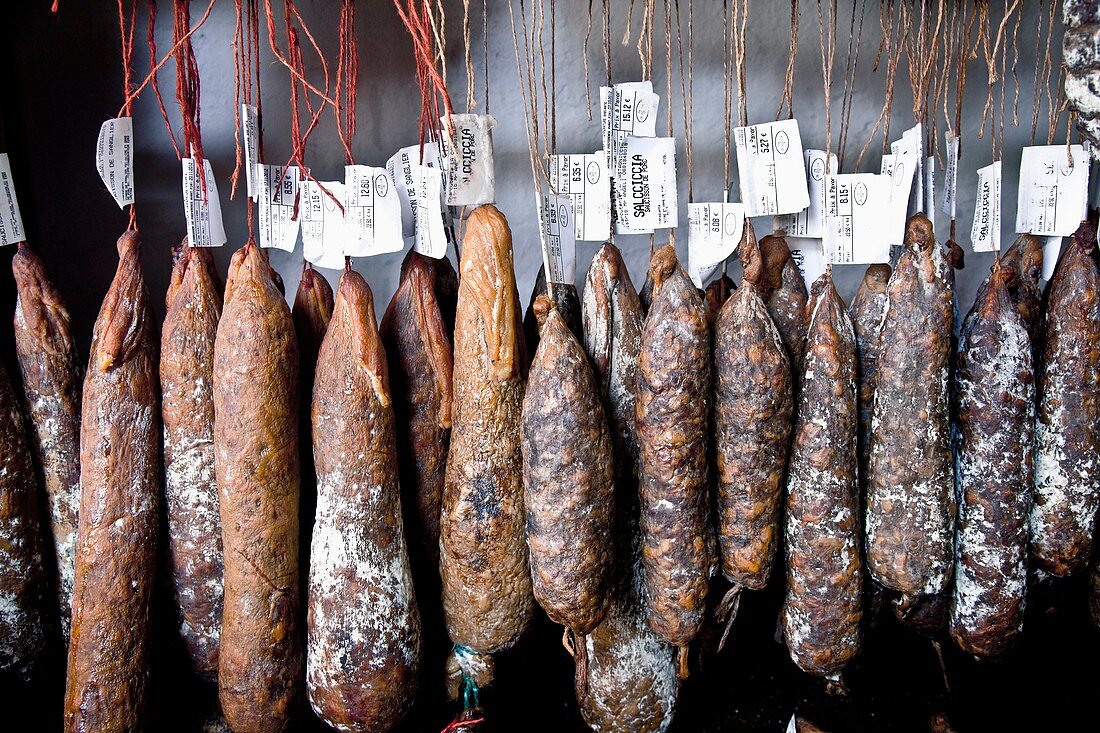 Corsican traditional sausages in a tent city of St-Florence tourist, France, Europe.